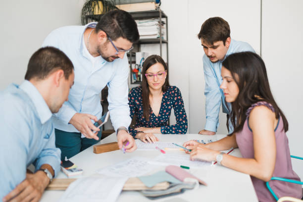 istock Young business people working and planning in the office 993201740