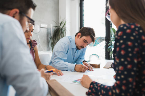 istock Young business people working and planning in the office 993201816