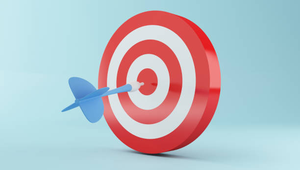 istock 3d Arrow hitting the center of red target. 993222586