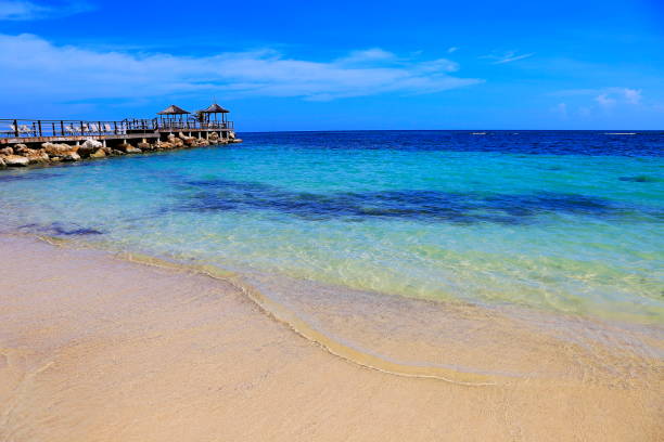 Beach with rustic gazebo on breakwater – Montego Bay - Jamaica, Caribbean sea