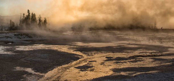 istock Sunrise at Grand Prismatic Spring through the steam 993264800