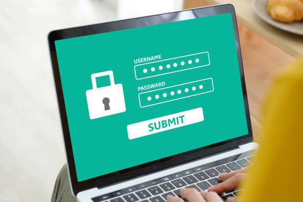 istock Hand tying laptop computer with password login on screen, cyber security concept 993286372