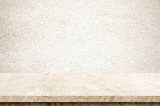 istock Empty brown cement table over brown wall background, banner, table top, shelf, counter design for product display montage 993288742