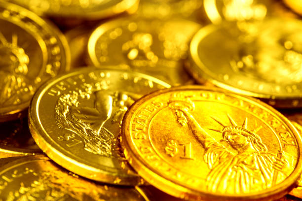 istock Closeup of US dollars coins background 993305714