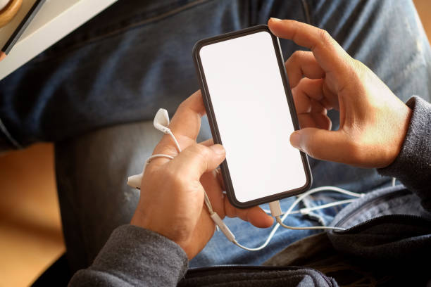 istock Cropped shot of an unrecognizable man using a mobile phone. Blank screen for graphic display montage 993308510