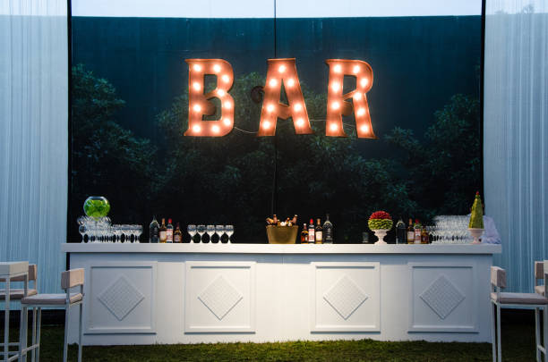 The bar is an open sign, the wooden bar painted white for a wedding, the concept of decoration stock photo
