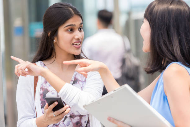 istock Young woman asking for directions 993354144