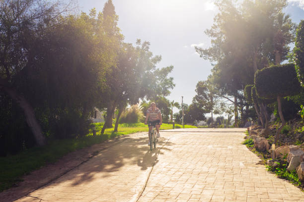 istock Young fit man during a bike ride on a sunny day 993358340