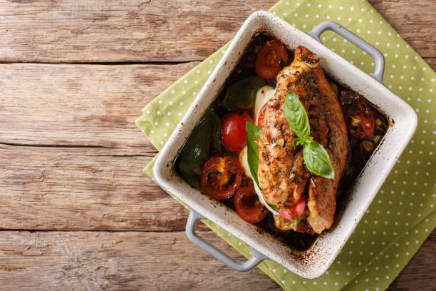 balsamic chicken stuffed with caprese close-up in a baking dish. horizontal top view - caprese salad salad restaurant vinegar imagens e fotografias de stock