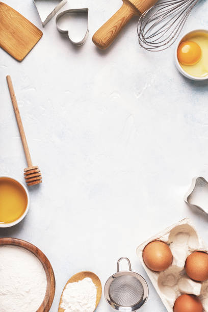 istock Ingredients for baking  - flour, wooden spoon, rolling pin, eggs. 993359716