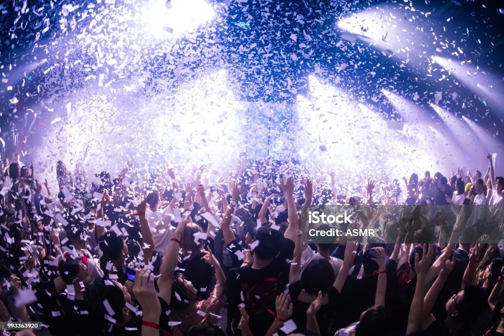 Cheering crowd at a concert Party - Social Event Stock Photo