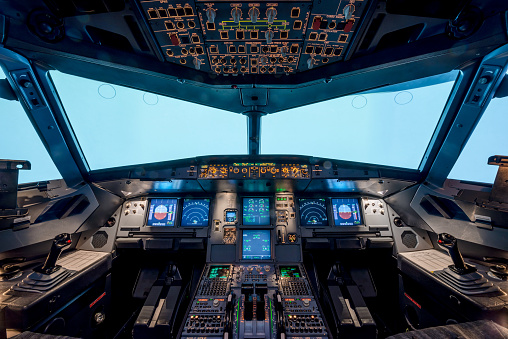 Boryspil, Ukraine - October 17 2018:  airplane cockpit with electronic flying navigation panel, buttons and levers.