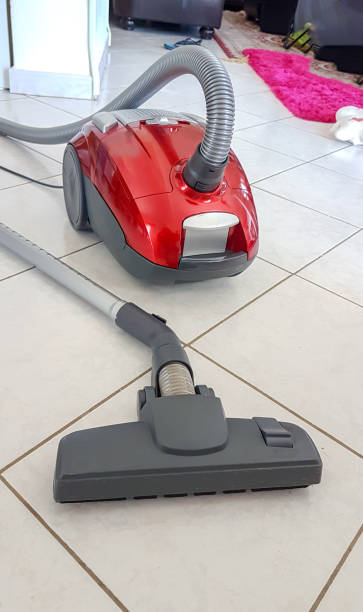 istock vacuum cleaner on the floor  red color 993367462