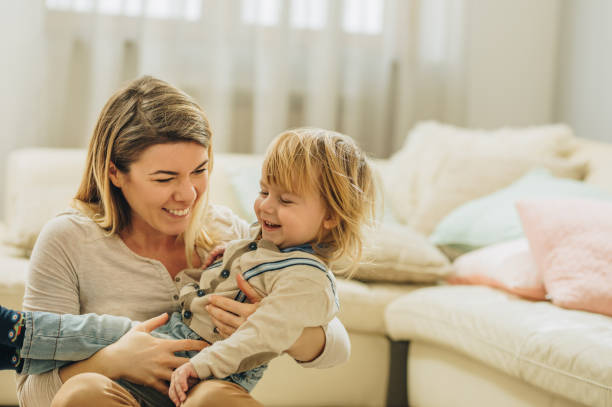 istock Playful mother and her small son having fun at home. 993394040