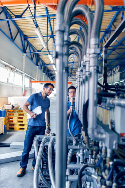 istock People at work. Industrial manufacture indoors. 993397590