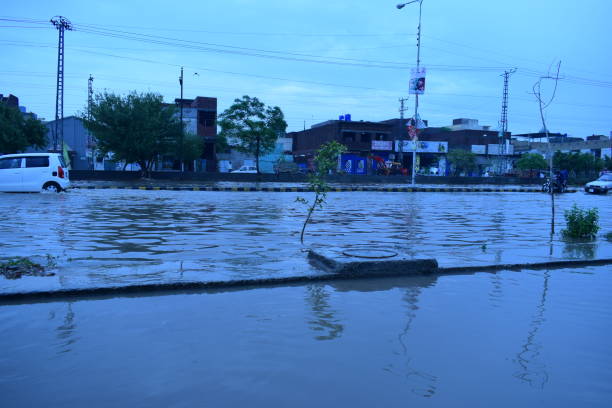 Walton Road Lahore Pakistan Flooded by Rain Water on 3-July-18 Heavy rain flooded the roads and vehicles on 3-July-18 in Lahore Pakistan pakistan photos stock pictures, royalty-free photos & images