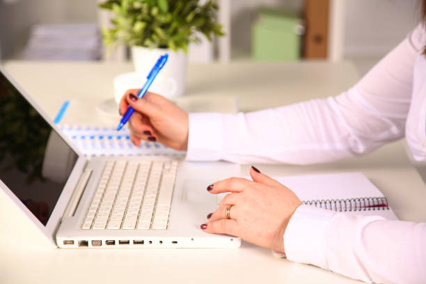 istock Young businesswoman working on a laptop 993419250