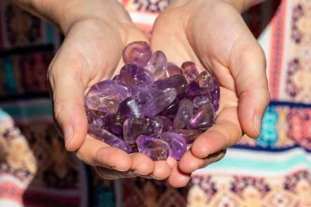 istock Hands holding many beautiful pieces of Quartz Crystal 993420230