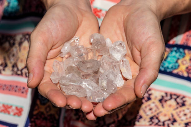 istock Hands holding many beautiful pieces of Quartz Crystal 993420348
