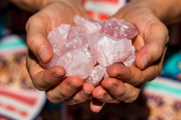 istock Hands holding many beautiful pieces of Rose Quartz Crystal 993420720