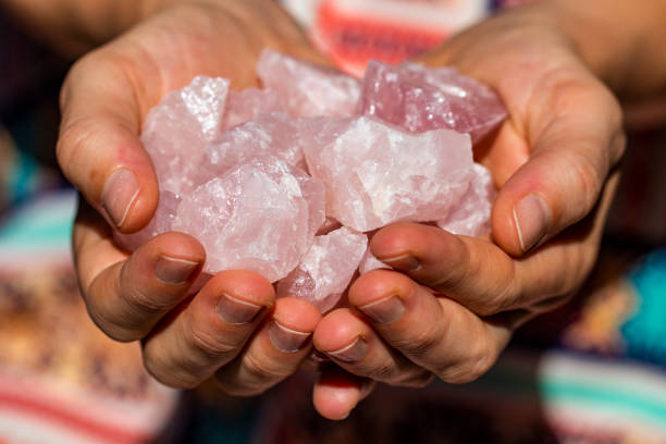 istock Hands holding many beautiful pieces of Rose Quartz Crystal 993420756