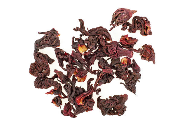 istock Dried petals of hibiscus on a white background. Carcade. 993426434
