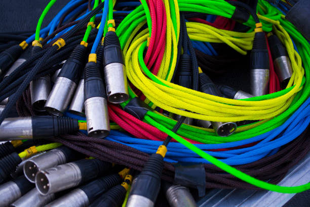 istock colorful sound and light signal cables on black stage case, shallow focus 993426532