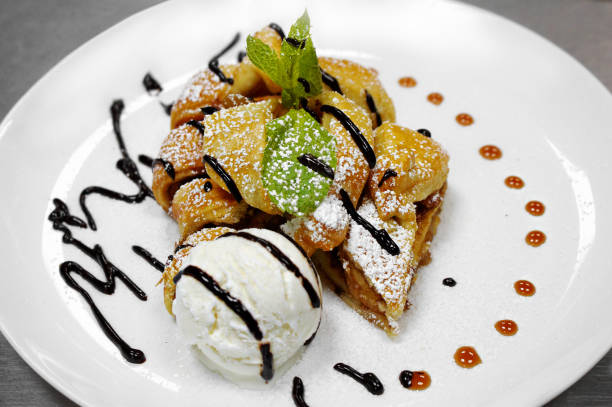 istock apple strudel with mint and ball of vanilla ice cream 993437436