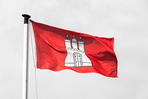 Civil and state flag of the Free and Hanseatic City of Hamburg, with the coat of arms showing a white castle with three towers on a red background (Gules, a castle triple-turreted Argent)