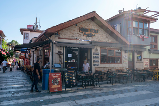 Antalya,Turkey -May 16, 2018:Kaleici is the historic city center of Antalya.Kaleici in Turkish which consists of old ottoman houses which have been converted into restaurants, hotels, small boutique hotels, cafes and shops.\nThis is a place you must visit on your trip to Antalya. Do not only walk on the main roads, but take your time to discover the small back streets as well in Kaleici. You must certainly have to stroll around the old city area . And then you can down to the marina area. There are nice little tea houses etc.
