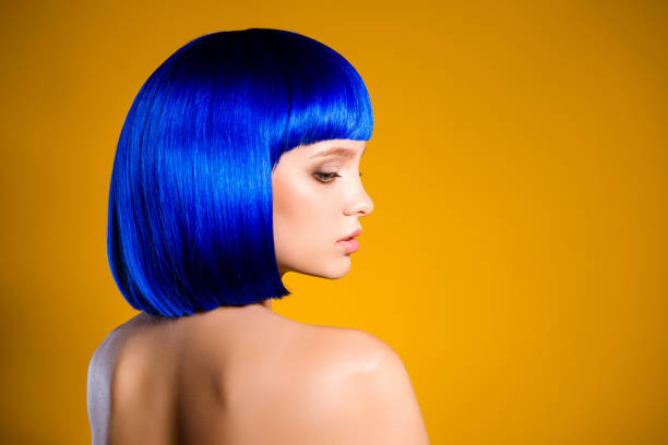 istock Profile portrait with copy space empty place for product of charming pretty woman in bright blue wig isolated on yellow background 993448564