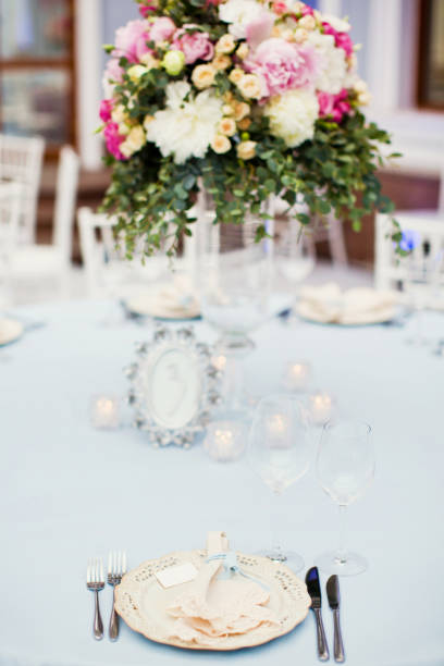 istock table appointments with flowers and white and blue decorations 993454944