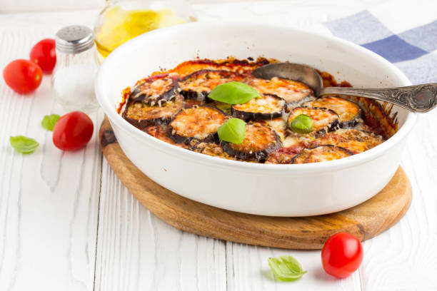 Eggplant casserole with tomato sauce, white cheese, tasty summer stew stock photo