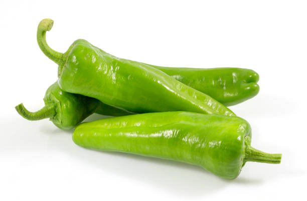 Green vegetables. Organic fresh long green peppers or green chilli horizontal isolated on white background, with clipping path. Green vegetables. Organic fresh long green peppers or green chilli horizontal isolated on white background, with clipping path. green chilli pepper stock pictures, royalty-free photos & images