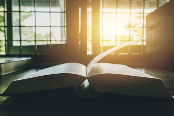 istock Book at the windows sun bright vintage colortone 993467880