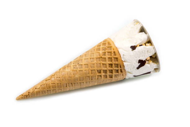 istock Ice cream cone sprinkled with chocolate and nuts isolated on white background. 993472072