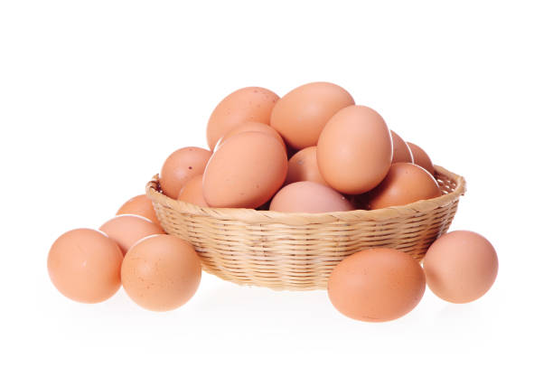 istock Basket with eggs in front of white background 993473798