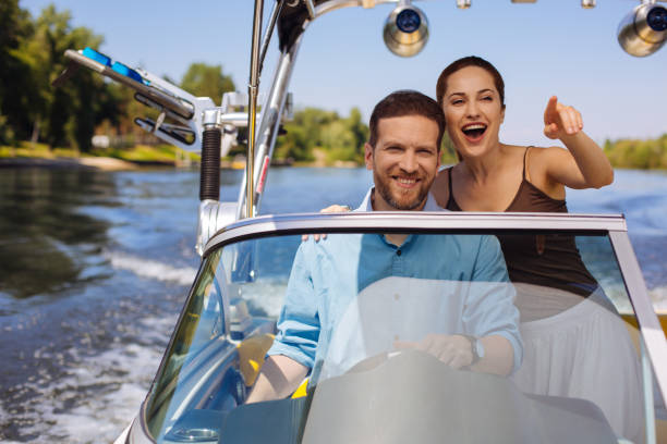 istock Charming young woman showing direction for sailing boat 993478168