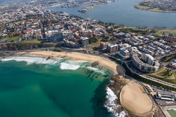 Newcastle Beach - Newcastle Australia aerial view. An aerial view of Newcastle beach and CBD showing residential and commercial areas and the Hunter river - Newcastle Port in the background. newcastle new south wales stock pictures, royalty-free photos & images