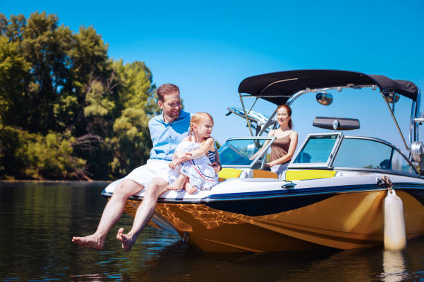 istock Pleasant young family relaxing on a motorboat 993481572