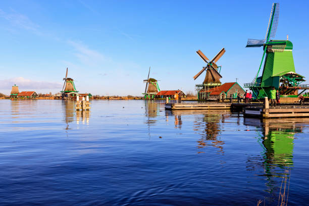 Windmill in Zaanse Schans, Netherlands Zaanse schans, Netherlands - December 17, 2017: windmills at Zaanse Schans, an industrial and national Dutch heritage site and famous tourist destination in the municipality of Zaandam, the Netherlands. Zaanse Schans is located on the river Zaan, from which its name derives. zaanse schans stock pictures, royalty-free photos & images