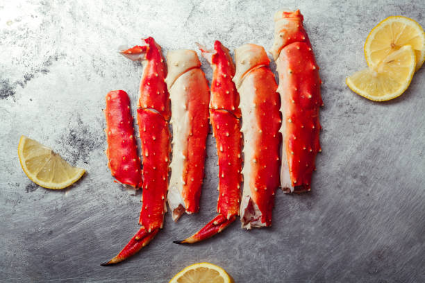 istock Cooked crab phalanx with lemon on metallic background. Top view with copy space. 993486638