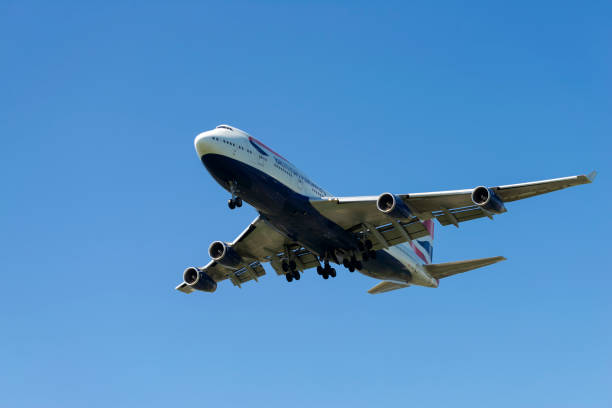 British Airways Airplane "Jumbo" 747 London, UK - January 23, 2016: British Airways airplane flying in a blue sky. Boing 747-436 Jumbo. british airways stock pictures, royalty-free photos & images
