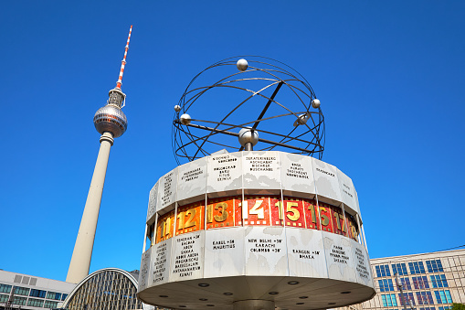 BERLIN - JULY 3, 2018: Berlin's Alexanderplatz, Weltzeituhr (World Time Clock), and TV Tower. Alexanderplatz is the central transportation hub of Berlin.