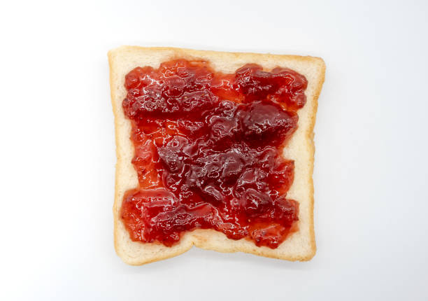 istock homemade slide bread with strawberry jam isolated on white background 993494582