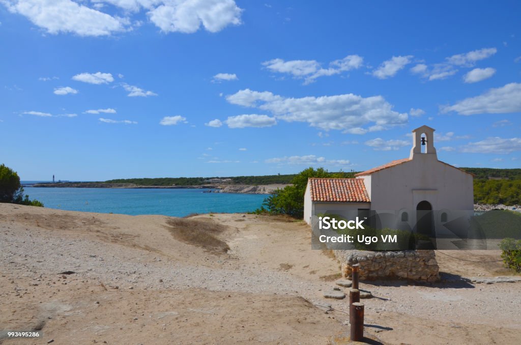 Old church next to the sea Old church view in the Sainte Croix beach, south of France Istres Stock Photo