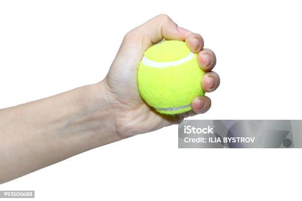 Tennis Ball In Hand Against White Background Stock Photo - Download Image Now - Exercising, Sports Ball, Wrist