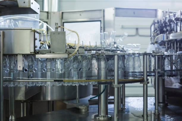 istock Water factory - Water bottling line for processing and bottling pure spring water into small bottles 993523510