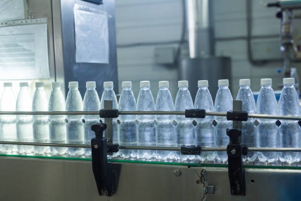 istock Closeup on mineral water bottles in raw and lines 993524480