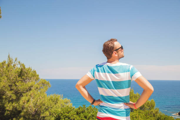 Man enjoying the view on the tropical beach.